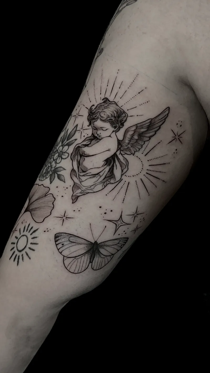 Fine line cherub with butterflies, sun and stars on the inner arm