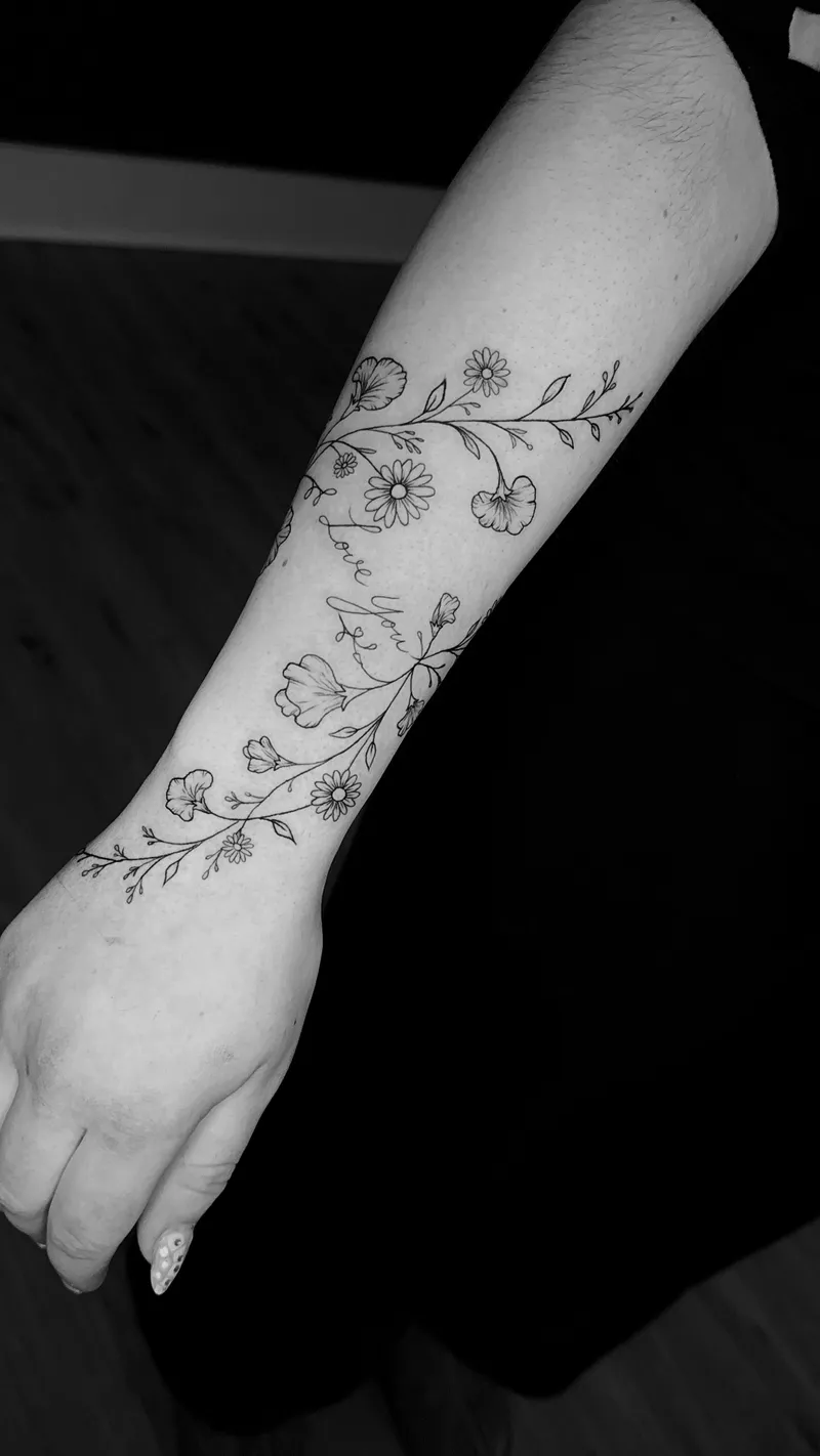 Fine line floral vine from elbow to wrist