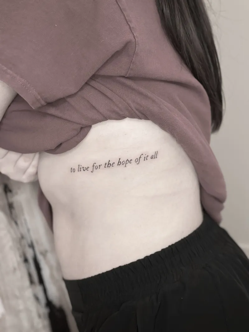 Fine line script along the ribs
