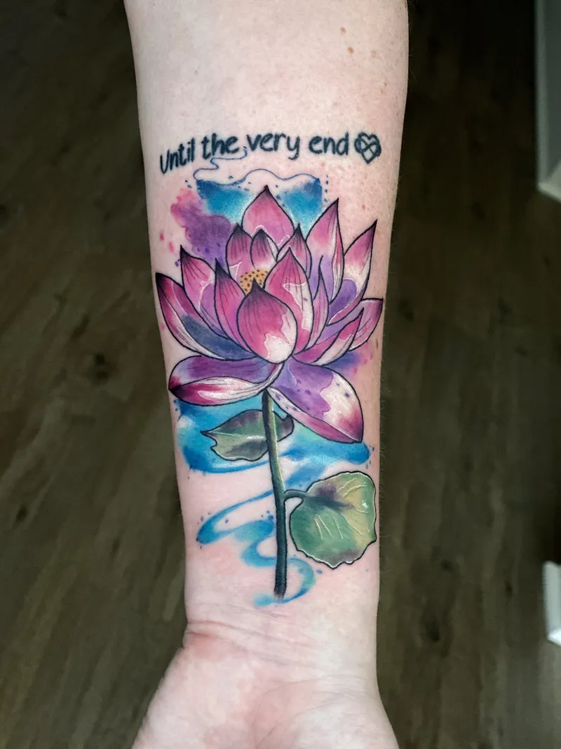 Watercolour lotus in pink and purple with a blue splash on the wrist